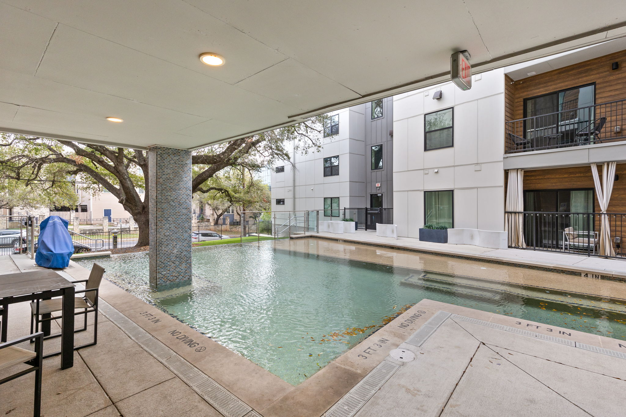 2500 Longview Street, Unit 405 Austin, TX 78705 - Photo 21 of 28 Community pool featuring a patio