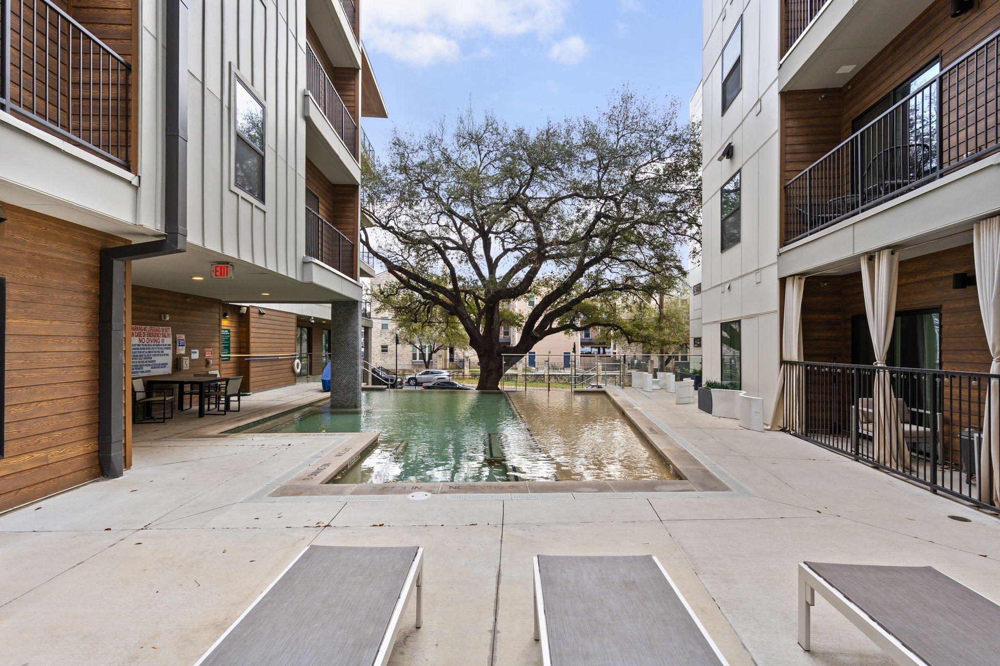 2500 Longview Street, Unit 405 Austin, TX 78705 - Photo 22 of 28 Community pool featuring a balcony and a patio area