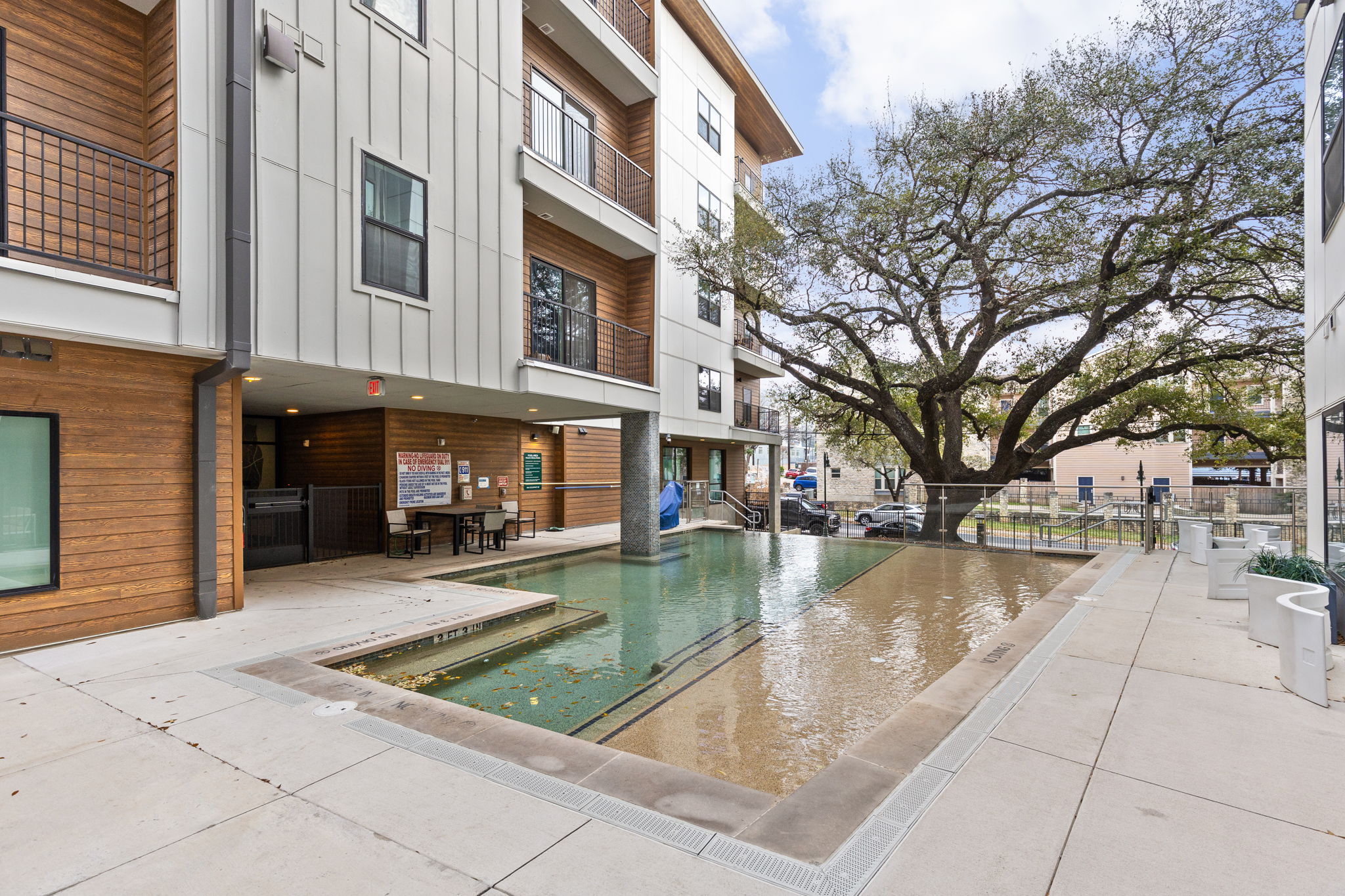 2500 Longview Street, Unit 405 Austin, TX 78705 - Photo 23 of 28 Community pool featuring a patio area