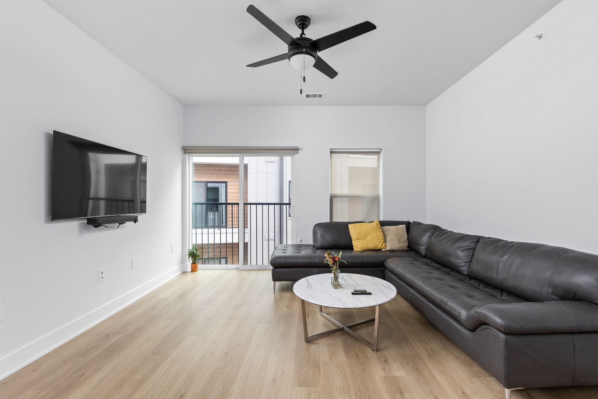 2500 Longview Street, Unit 405 Austin, TX 78705 - Photo 8 of 28 Living area with light wood-type flooring and ceiling fan
