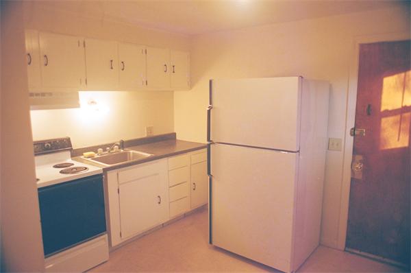 31 Hope Street Springfield, MA 01119 - Photo 4 of 9 a kitchen with a refrigerator and a stove