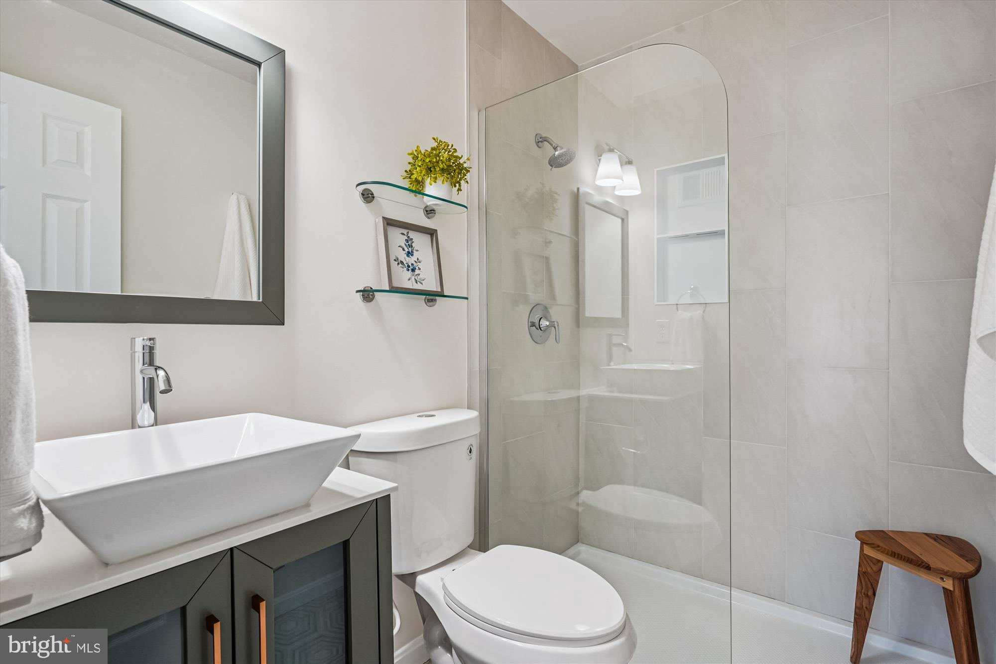 5146 Spring Branch Boulevard Dumfries, VA 22025 - Photo 18 of 38 a bathroom with a sink toilet and shower