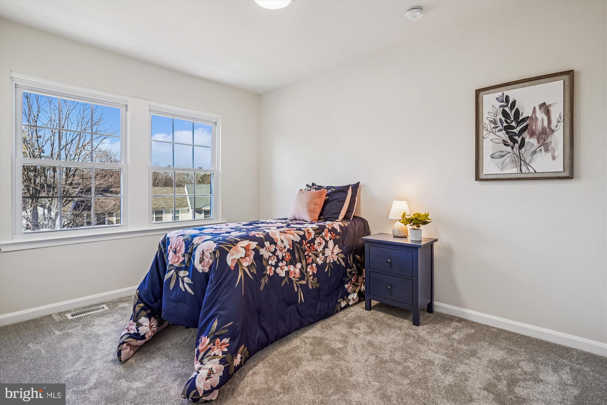 5146 Spring Branch Boulevard Dumfries, VA 22025 - Photo 20 of 38 a bed sitting in a bedroom next to a window