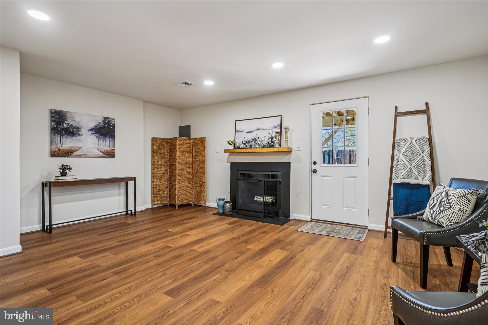 5146 Spring Branch Boulevard Dumfries, VA 22025 - Photo 24 of 38 a living room with furniture and a fireplace