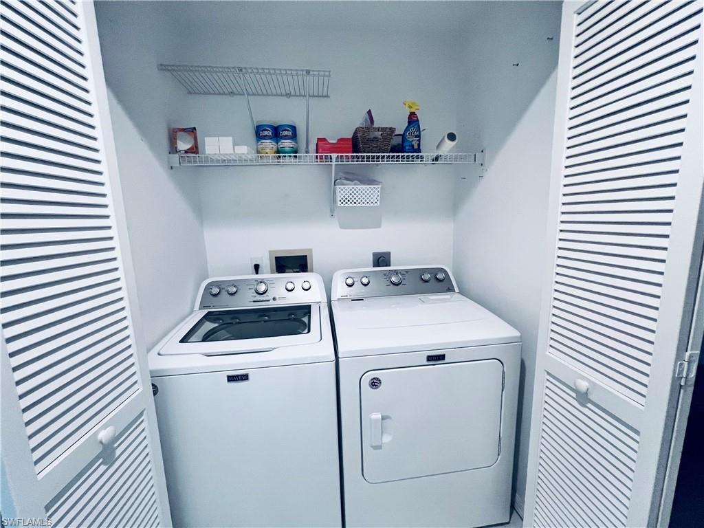 8073 Panther Trail, Unit 1404 Naples, FL 34113 - Photo 20 of 28 a utility room with dryer and washer
