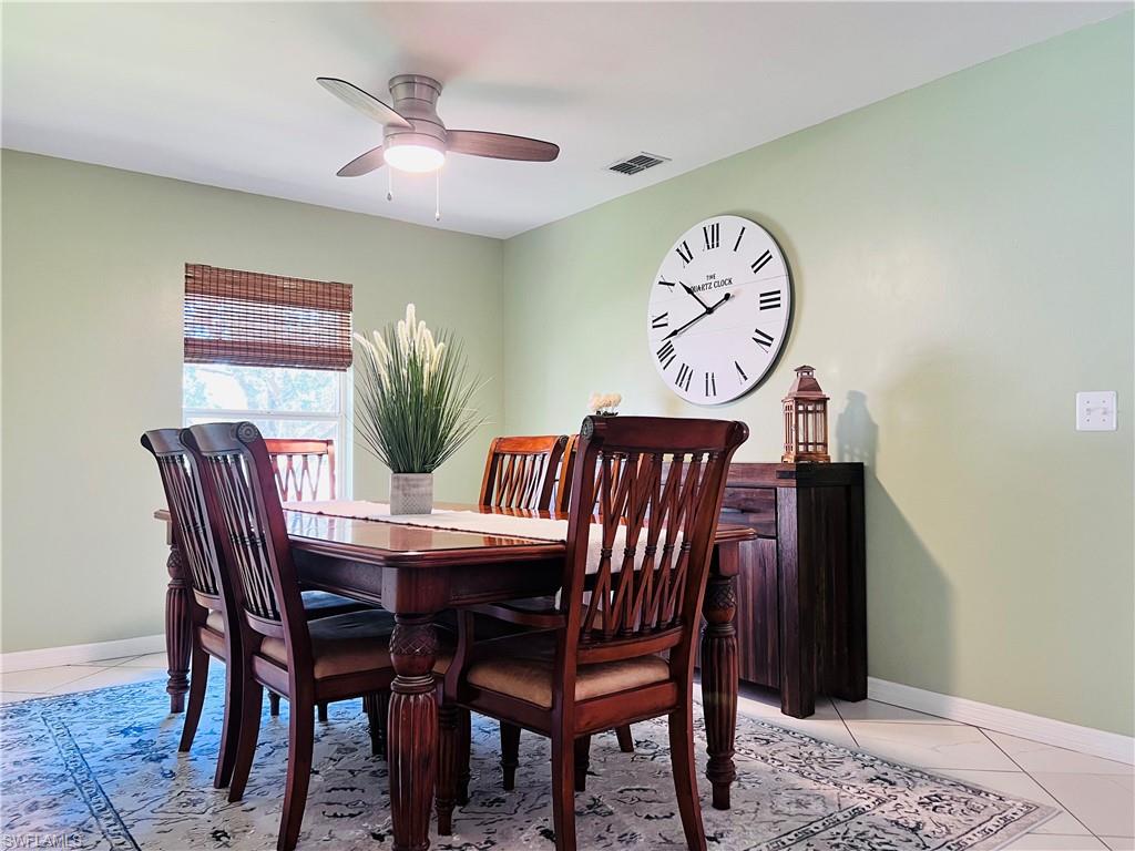 8073 Panther Trail, Unit 1404 Naples, FL 34113 - Photo 5 of 28 a view of a dining room with furniture