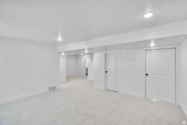 2816 West Aurora Avenue Mapleton, UT 84664 - Photo 20 of 20 Finished below grade area with light colored carpet and a textured ceiling