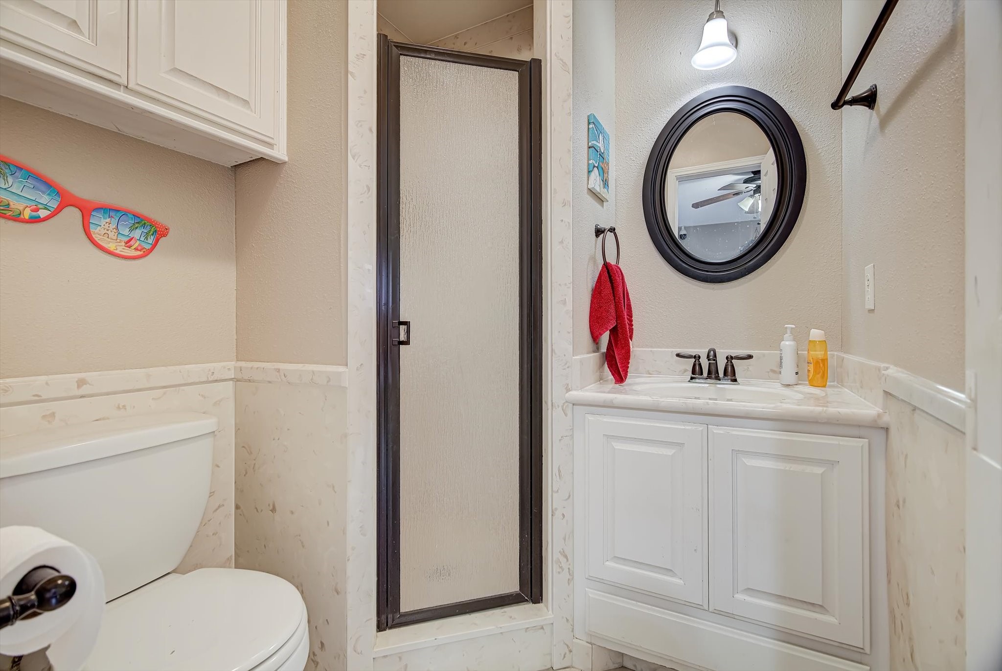 20205 Highway 146 Liberty, TX 77575 - Photo 26 of 50 a bathroom with a toilet a sink and a mirror