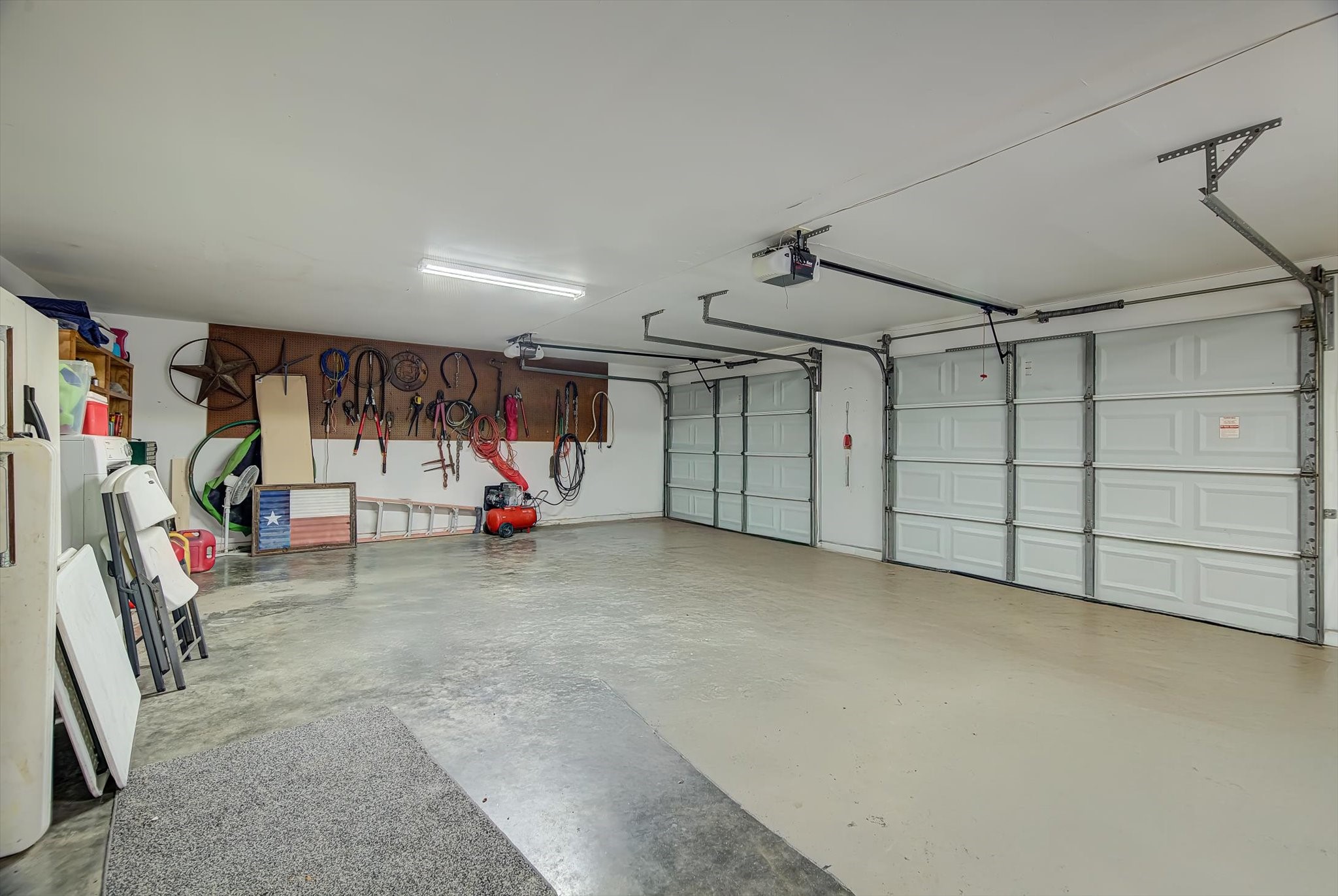 20205 Highway 146 Liberty, TX 77575 - Photo 29 of 50 a view of a garage with gym equipment