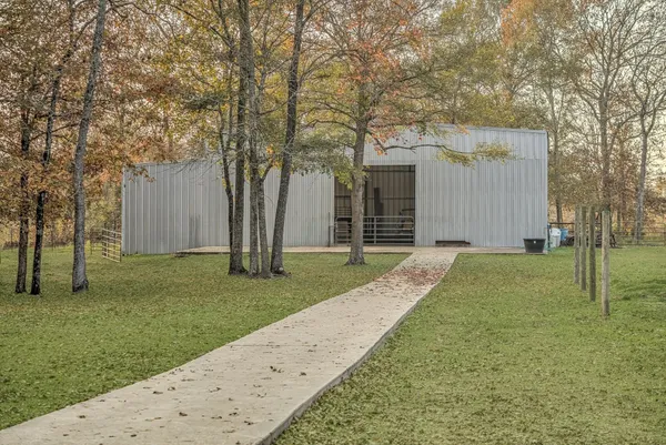 a view of a house with a chairs in patio