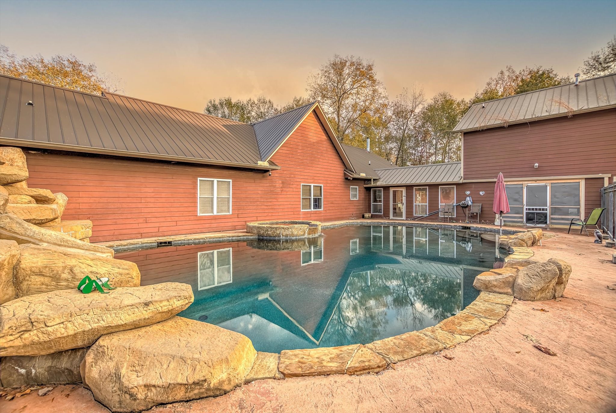 20205 Highway 146 Liberty, TX 77575 - Photo 32 of 50 a view of a house with a chairs in patio