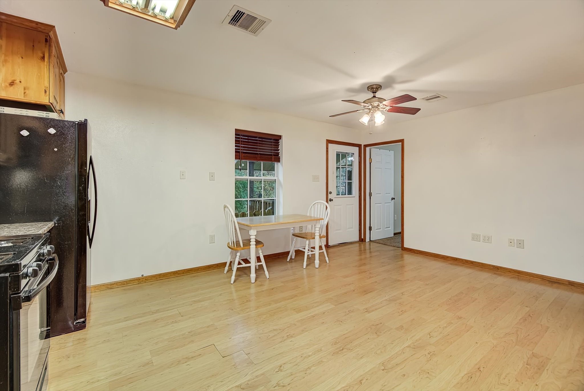 20205 Highway 146 Liberty, TX 77575 - Photo 38 of 50 wooden floor in an empty room with a window