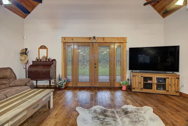a living room with furniture and a flat screen tv