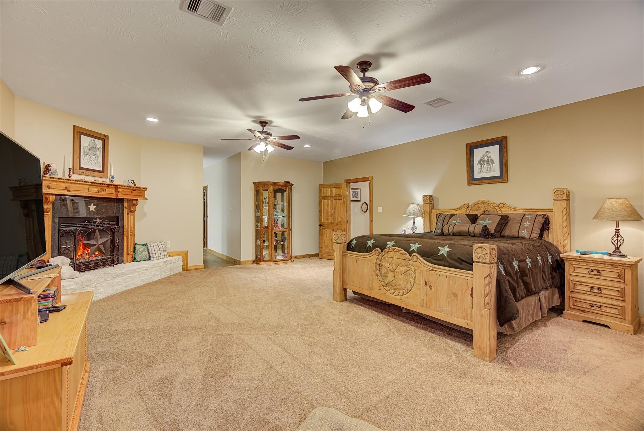 20205 Highway 146 Liberty, TX 77575 - Photo 8 of 50 a spacious bedroom with a bed and ceiling fan