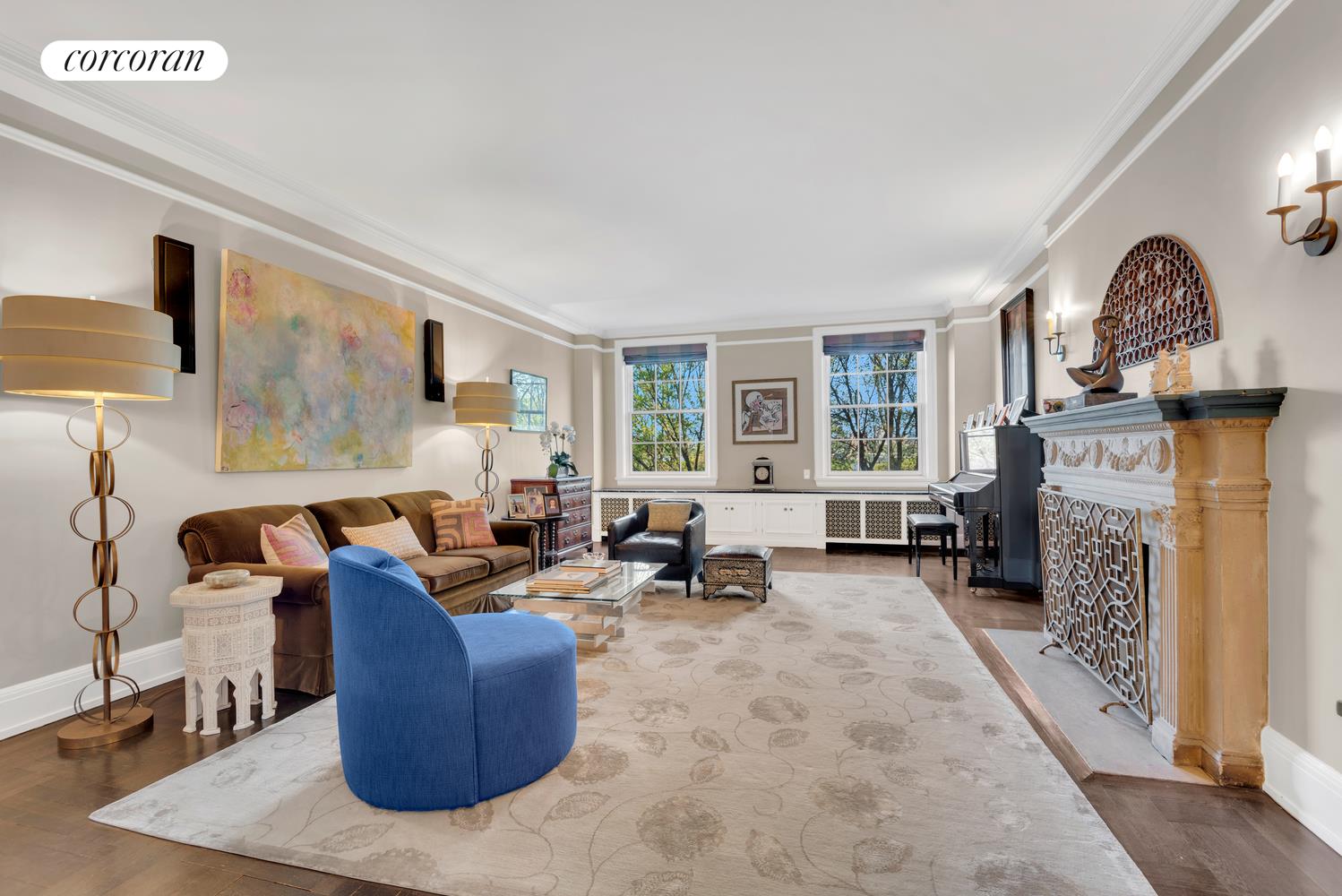 a living room with furniture a fireplace and a flat screen tv