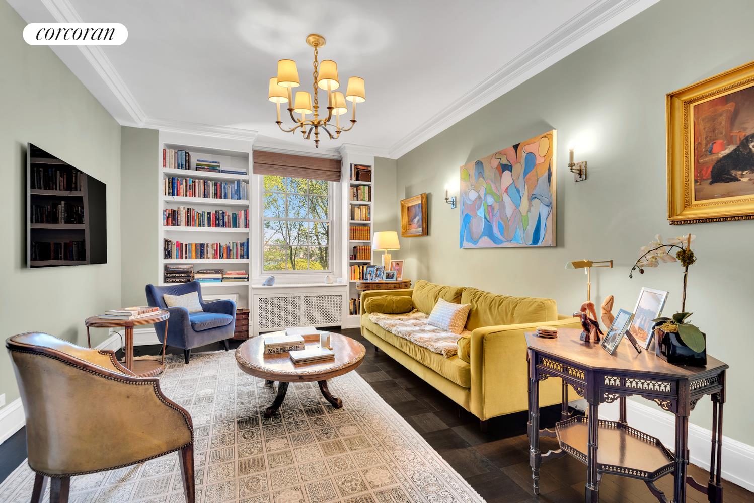 173-175 Riverside Drive, Unit 6D Manhattan, NY 10024 - Photo 10 of 18 a living room with furniture a chandelier and a window