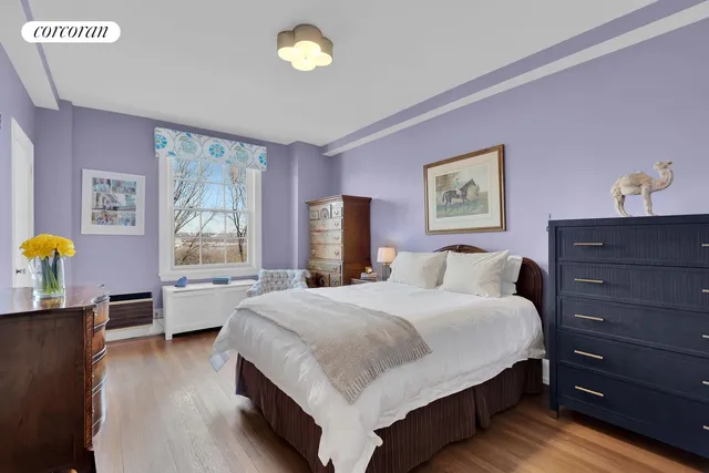 a view of a workspace with furniture and a flat screen tv