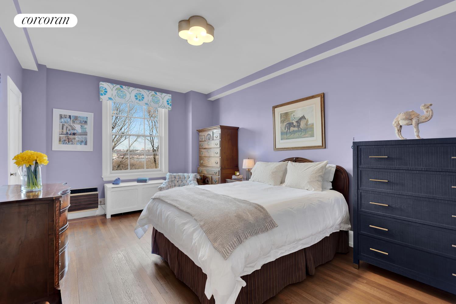 173-175 Riverside Drive, Unit 6D Manhattan, NY 10024 - Photo 14 of 18 a bedroom with a bed and wooden floor