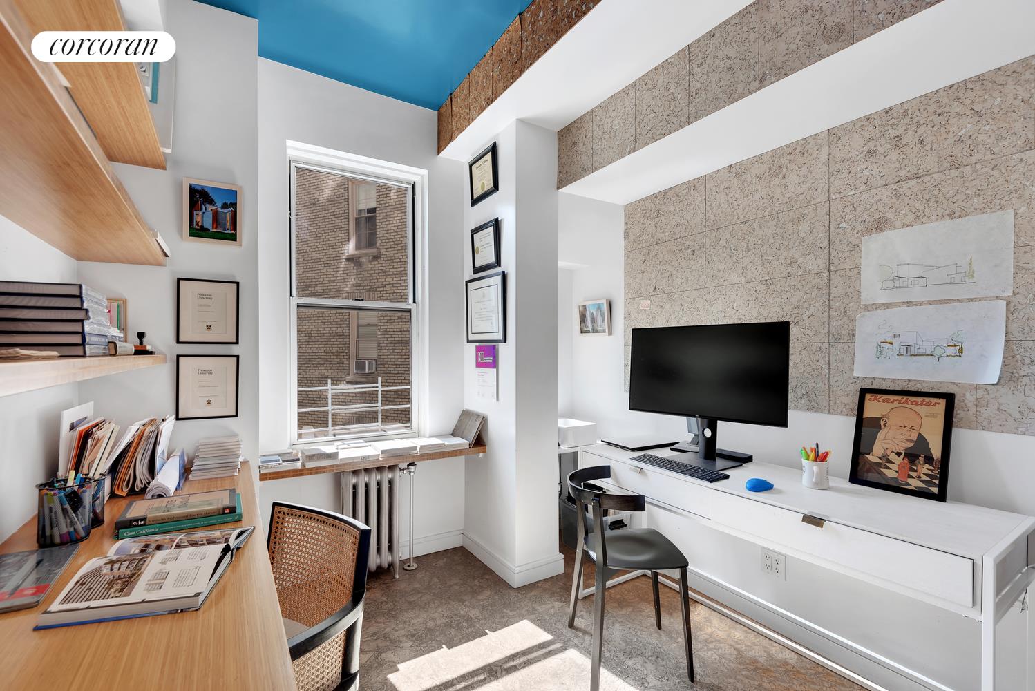 173-175 Riverside Drive, Unit 6D Manhattan, NY 10024 - Photo 15 of 18 a view of a workspace with furniture and a flat screen tv