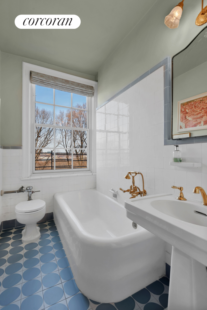 173-175 Riverside Drive, Unit 6D Manhattan, NY 10024 - Photo 17 of 18 a bathroom with a sink and mirror with toilet