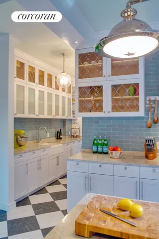a kitchen with a sink and cabinets