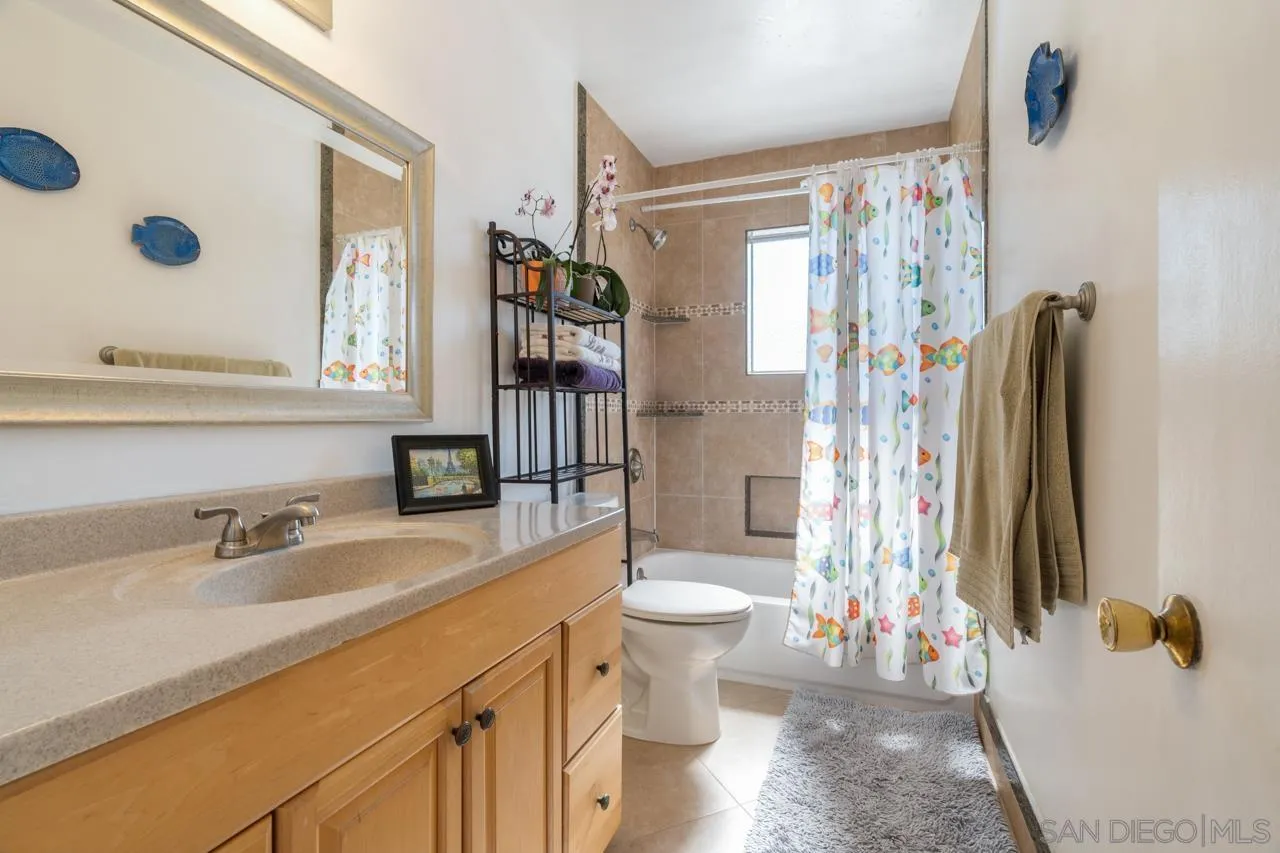 4530 Vandever Avenue, Unit 6 San Diego, CA 92120 - Photo 15 of 25 a bathroom with a sink toilet and shower