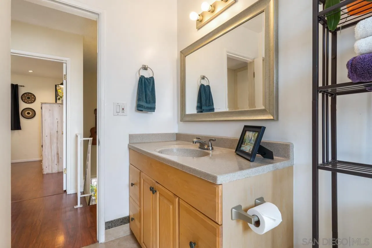 4530 Vandever Avenue, Unit 6 San Diego, CA 92120 - Photo 16 of 25 a bathroom with a sink a mirror and shower