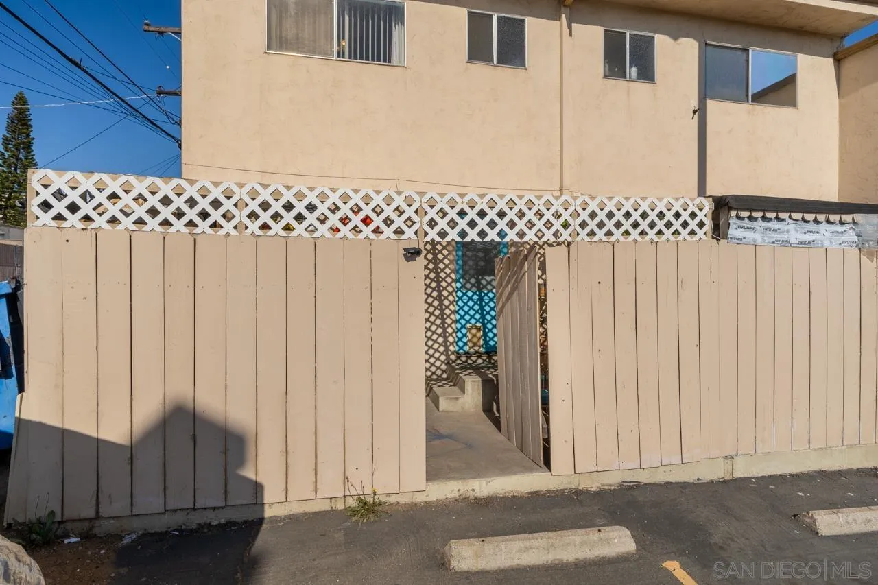 4530 Vandever Avenue, Unit 6 San Diego, CA 92120 - Photo 22 of 25 a view of a house with wooden fence