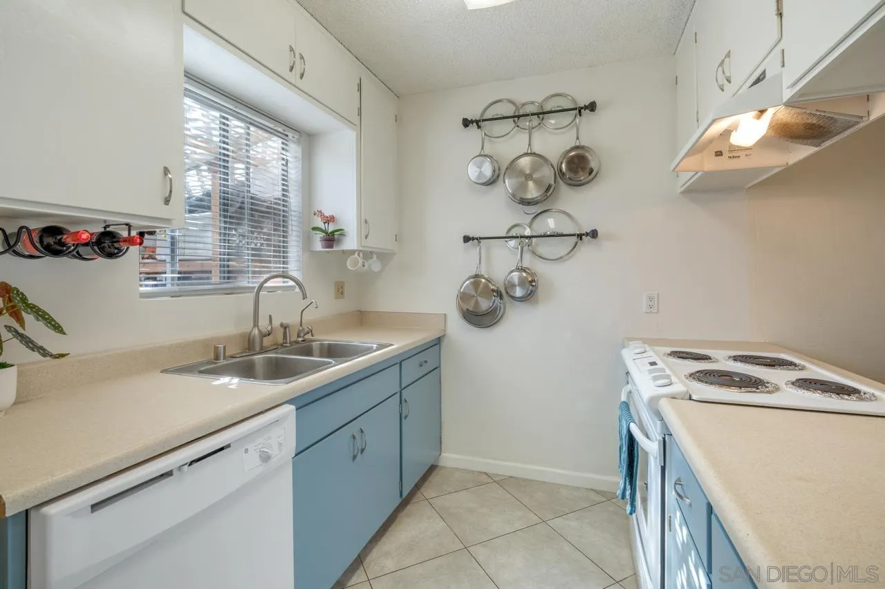 4530 Vandever Avenue, Unit 6 San Diego, CA 92120 - Photo 7 of 25 a room with a sink and cabinets