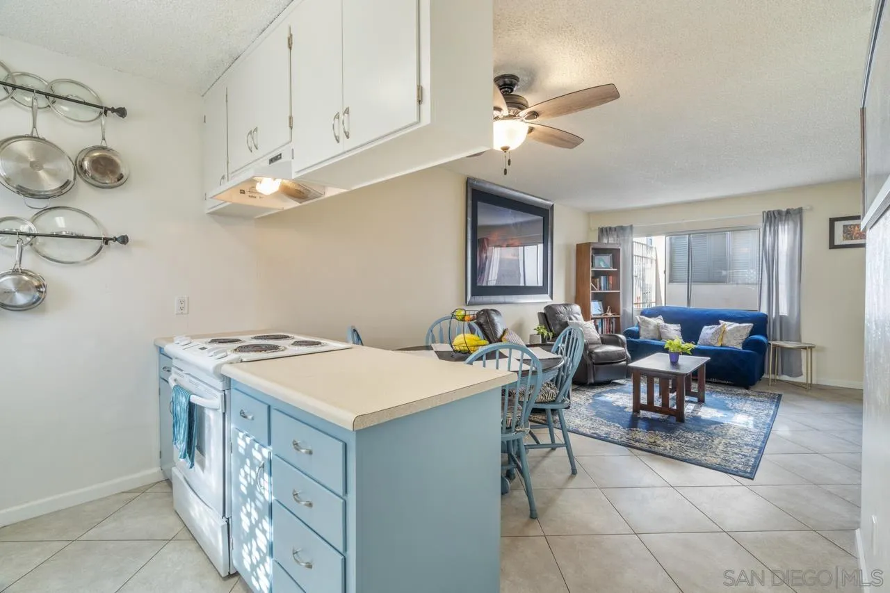 4530 Vandever Avenue, Unit 6 San Diego, CA 92120 - Photo 8 of 25 a room with furniture a chandelier a sink and a window