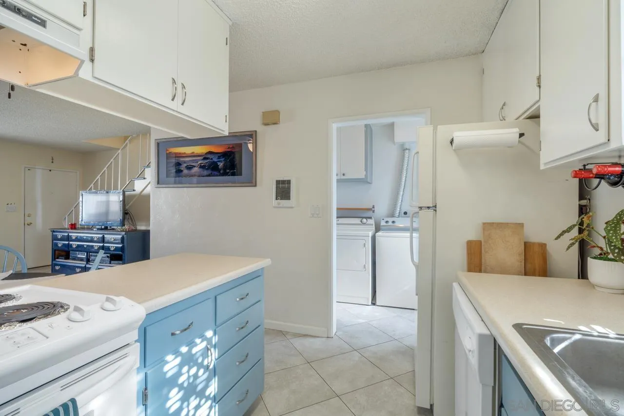 4530 Vandever Avenue, Unit 6 San Diego, CA 92120 - Photo 9 of 25 a kitchen with a sink and a refrigerator