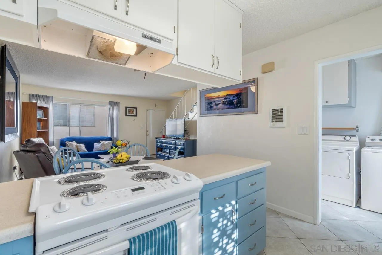 4530 Vandever Avenue, Unit 6 San Diego, CA 92120 - Photo 10 of 25 a spacious bathroom with a sink a vanity and mirror