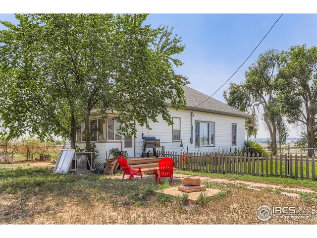 a view of a house with a wooden deck