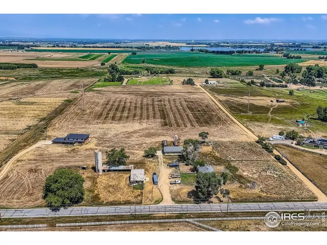 a view of a swimming pool with a yard