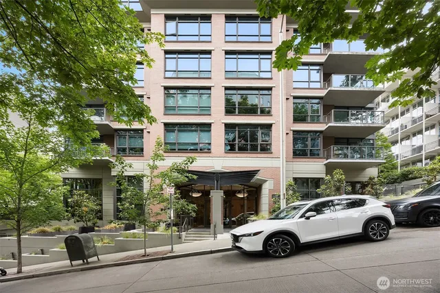 a view of building with parking space