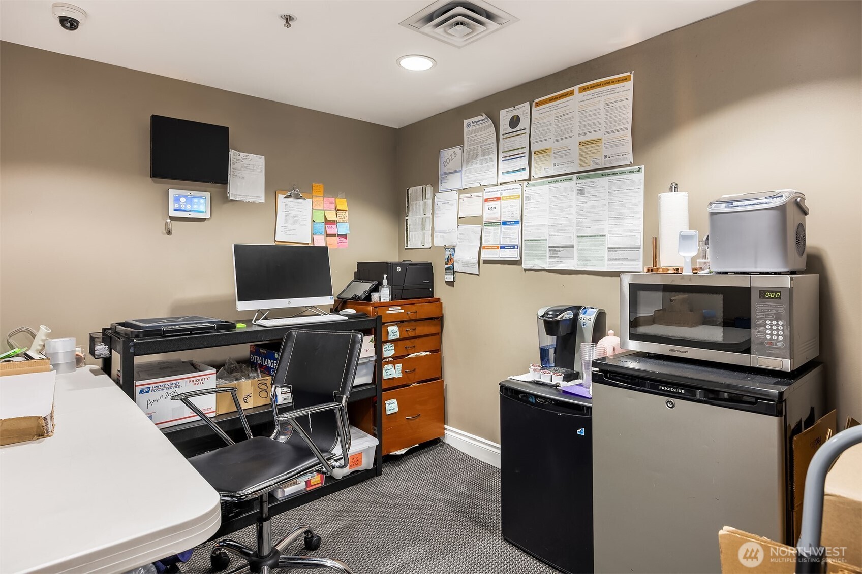 1420 Terry Avenue, Unit OU Seattle, WA 98101 - Photo 5 of 12 a view of a workspace with furniture and a window