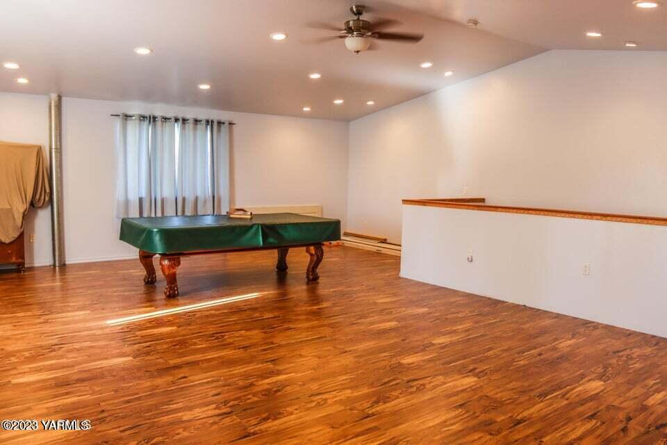 231 Taylor Loop Road Selah, WA 98942 - Photo 18 of 18 a room with lots of furniture and wooden floor