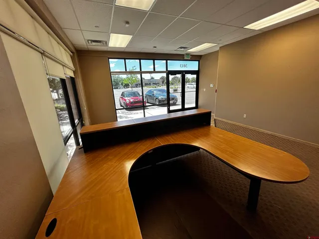 a living room with furniture and white walls