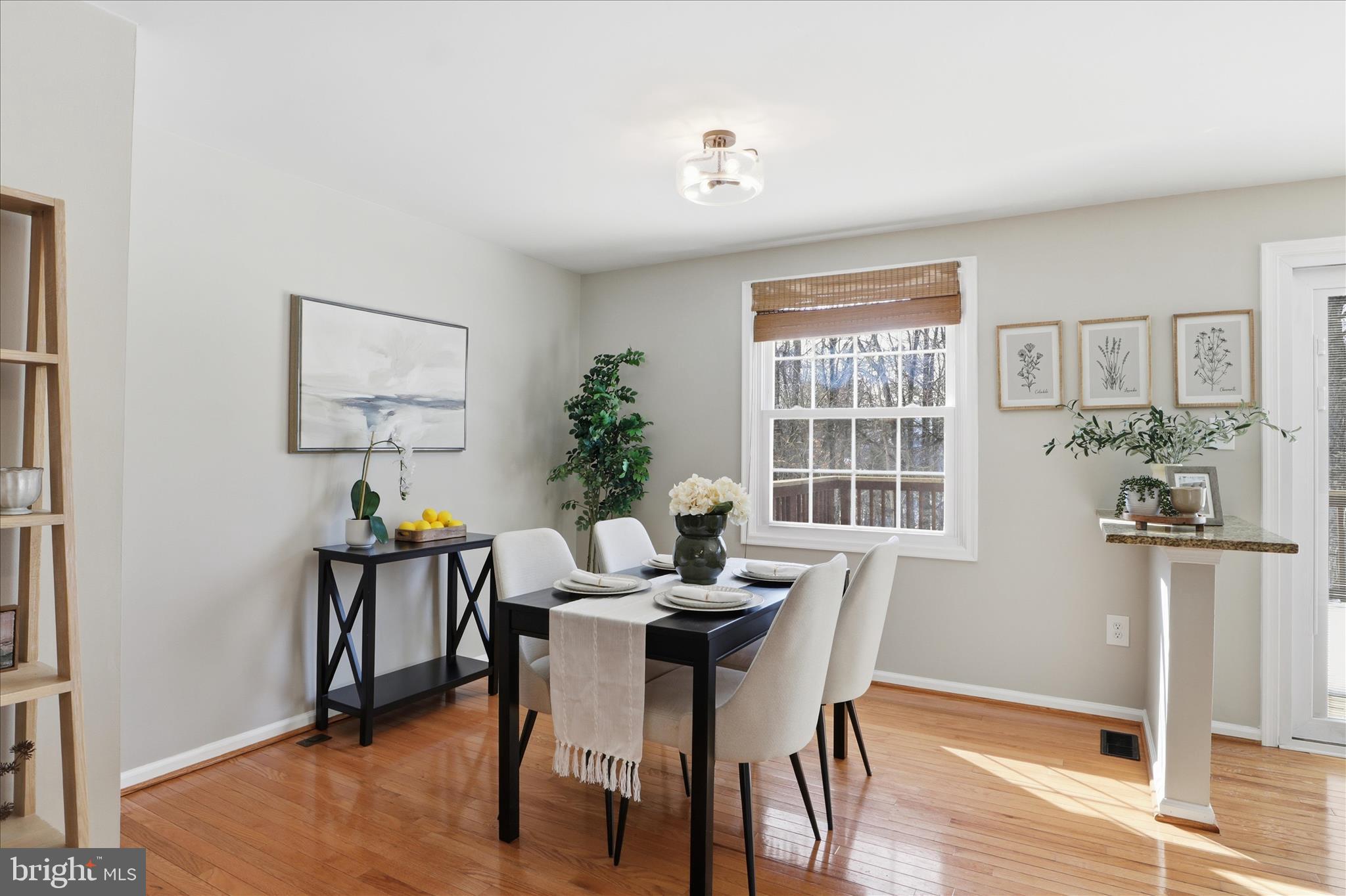 1563 Twisted Oak Drive Reston, VA 20194 - Photo 11 of 47 a view of a dining room with furniture window and wooden floor