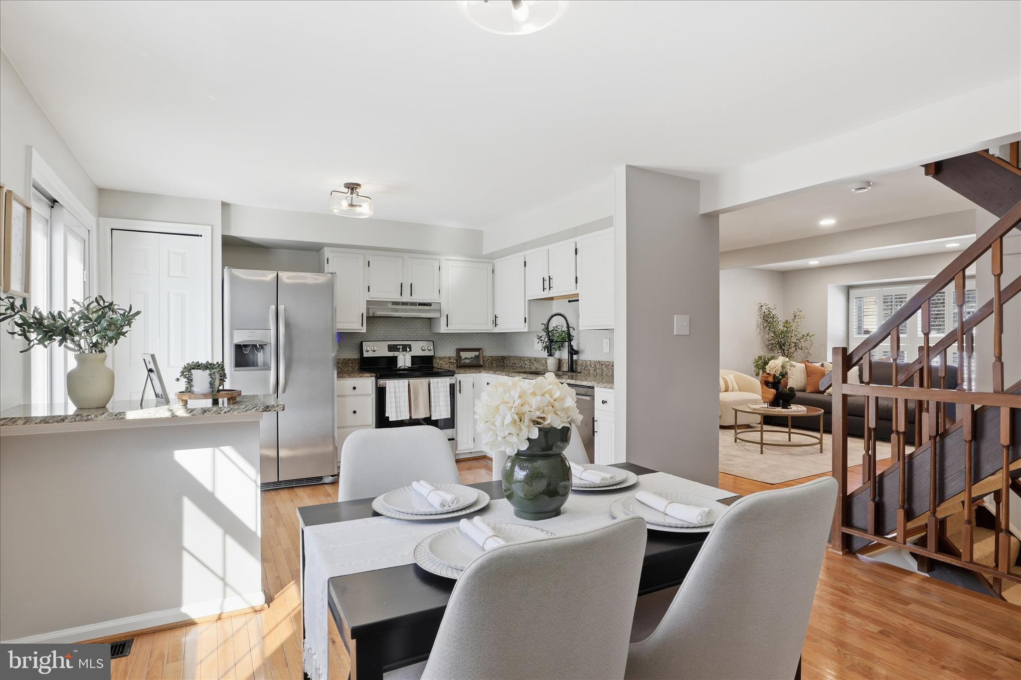 1563 Twisted Oak Drive Reston, VA 20194 - Photo 12 of 47 a dining room with furniture a chandelier and kitchen view