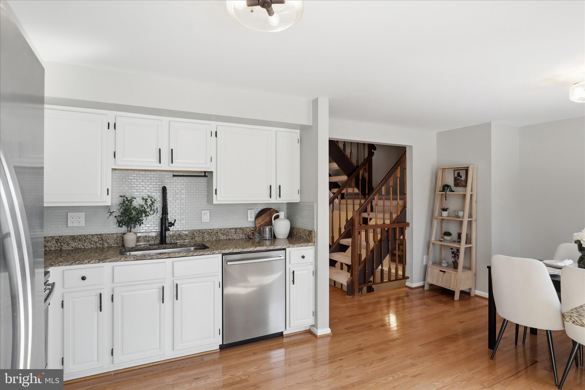 1563 Twisted Oak Drive Reston, VA 20194 - Photo 16 of 47 a kitchen with white cabinets and sink