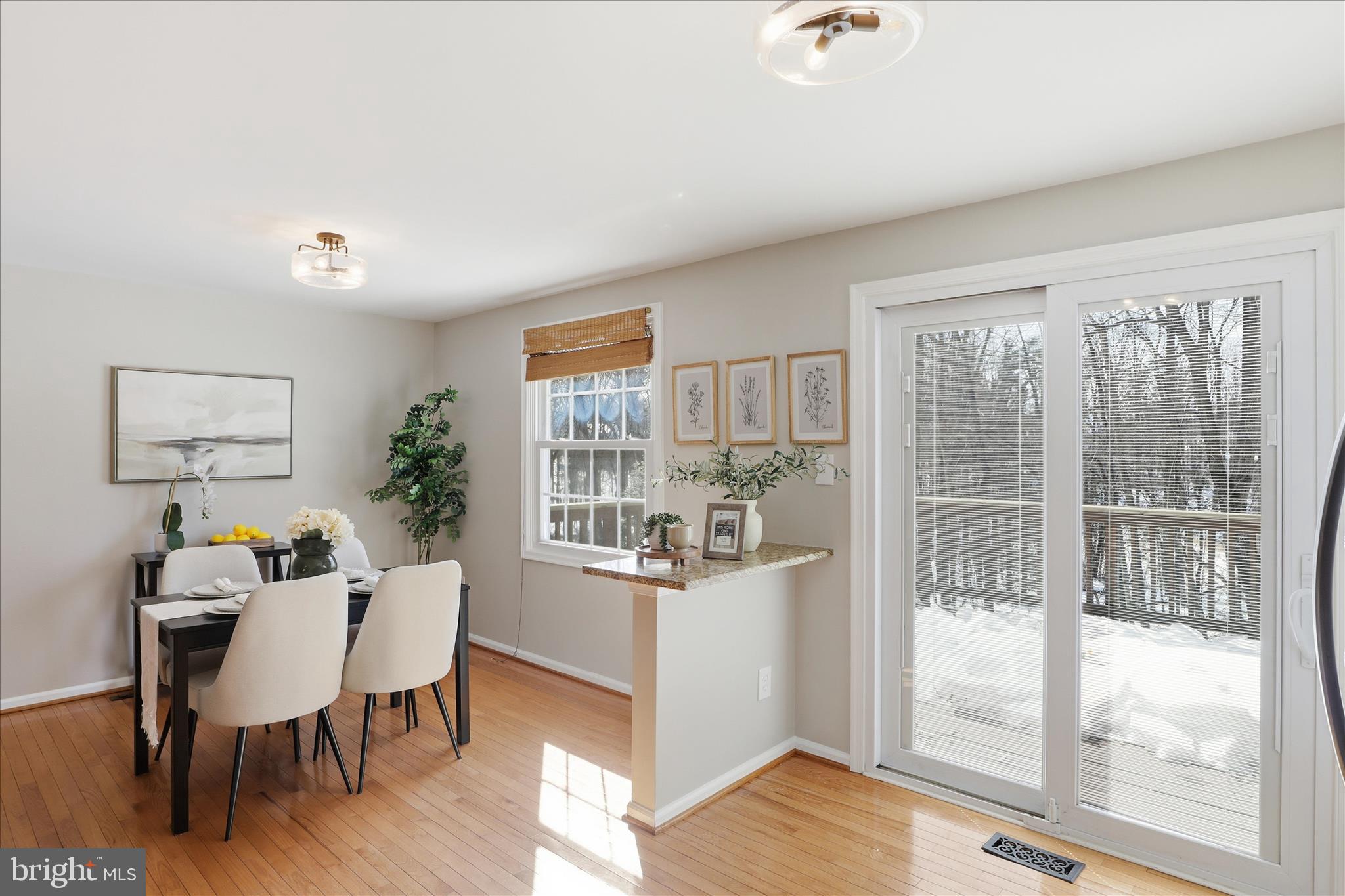 1563 Twisted Oak Drive Reston, VA 20194 - Photo 17 of 47 a view of a dining room with furniture window and wooden floor