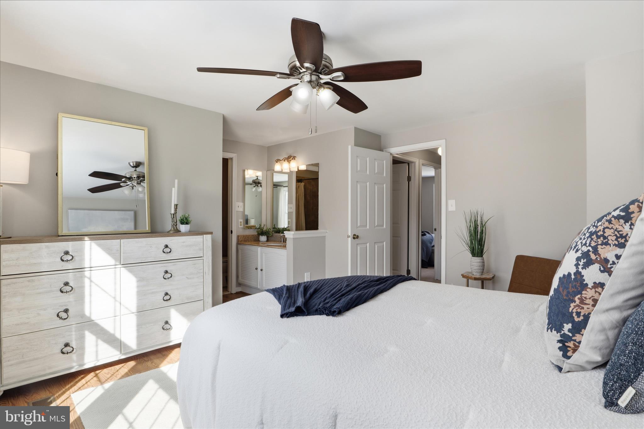 1563 Twisted Oak Drive Reston, VA 20194 - Photo 22 of 47 a bedroom with a bed and a chandelier