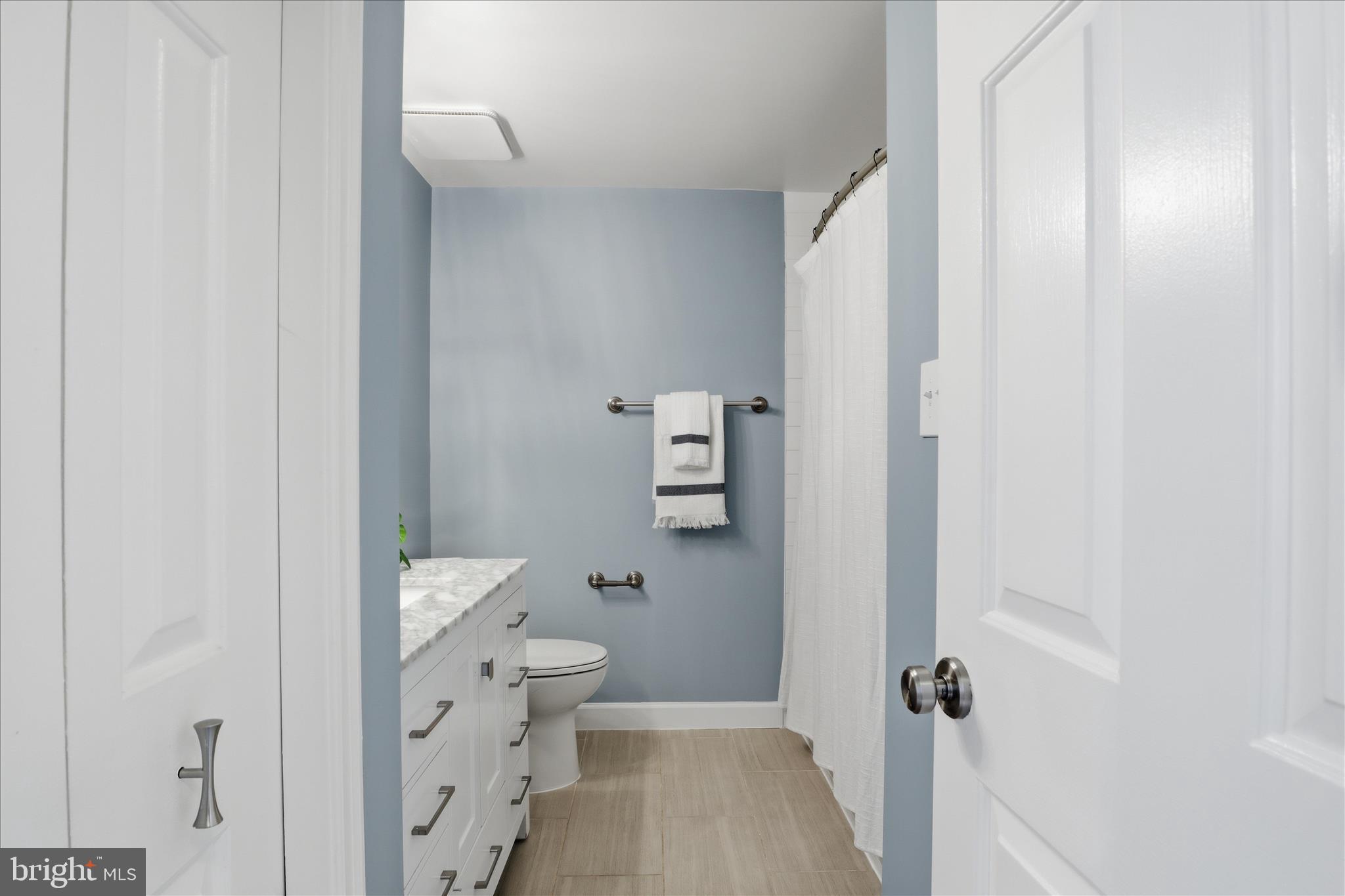 1563 Twisted Oak Drive Reston, VA 20194 - Photo 28 of 47 a bathroom with a toilet and a shower