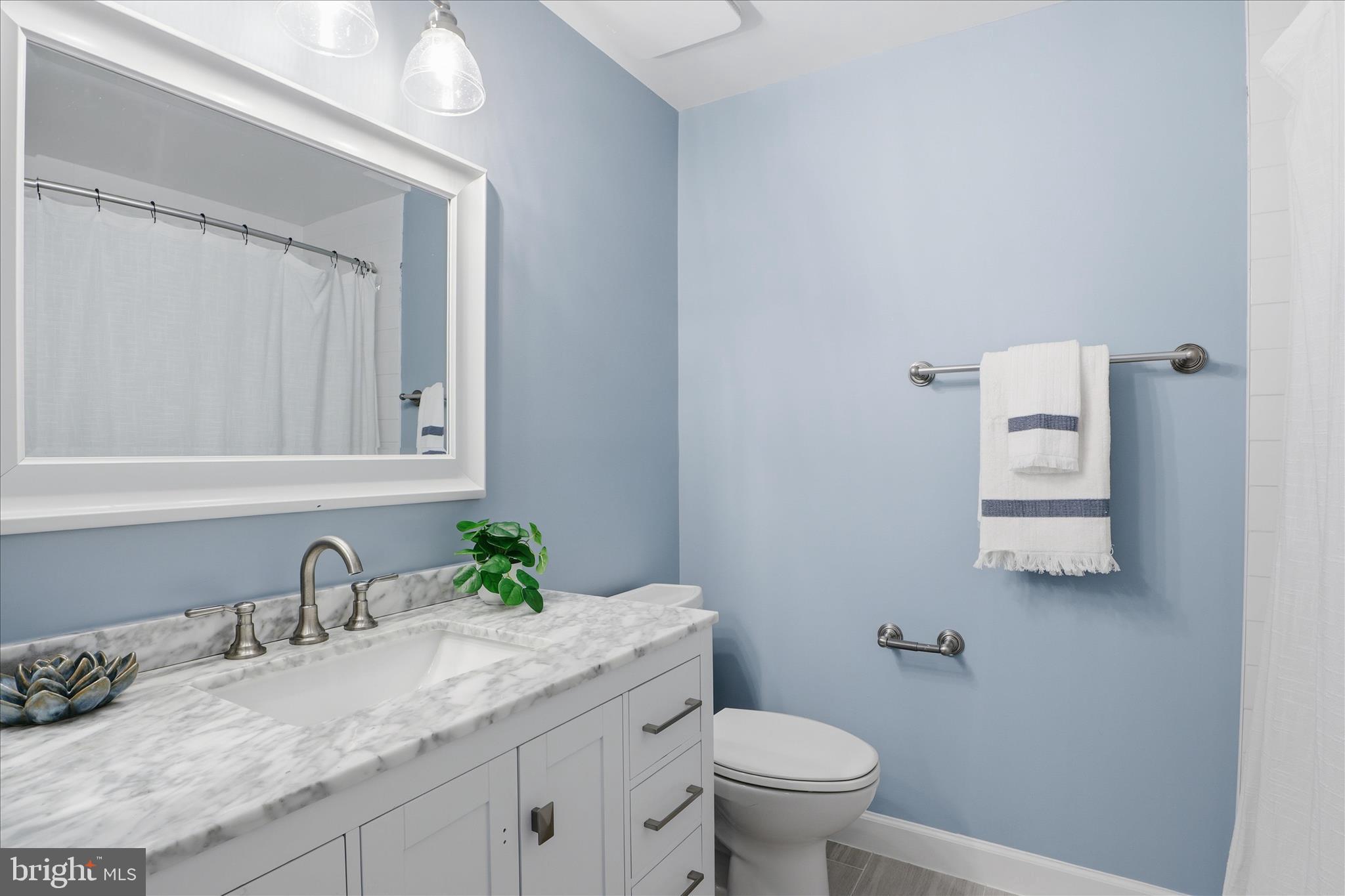 1563 Twisted Oak Drive Reston, VA 20194 - Photo 29 of 47 a bathroom with a granite countertop sink and a toilet