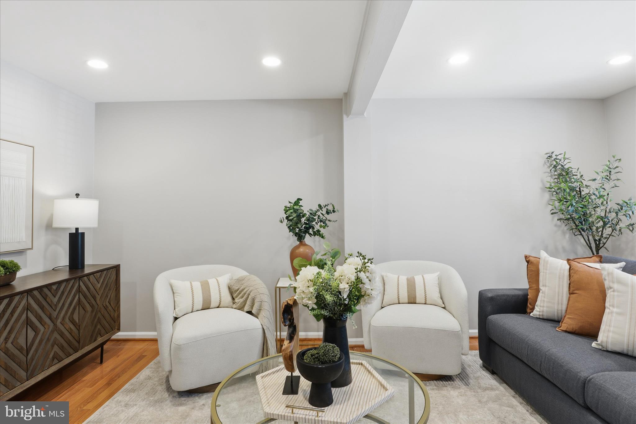 1563 Twisted Oak Drive Reston, VA 20194 - Photo 9 of 47 a living room with furniture flowerpot and a chandelier