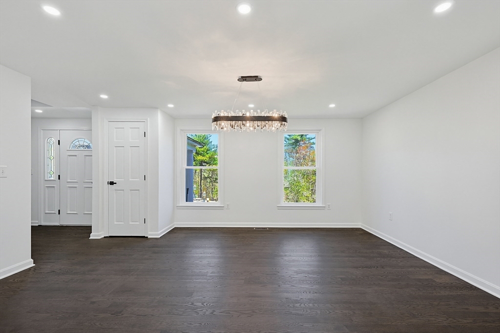 175 Pleasant Street Upton, MA 01568 - Photo 14 of 39 an empty room with wooden floor and window