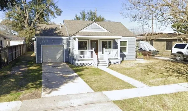 a front view of a house with yard and seating area