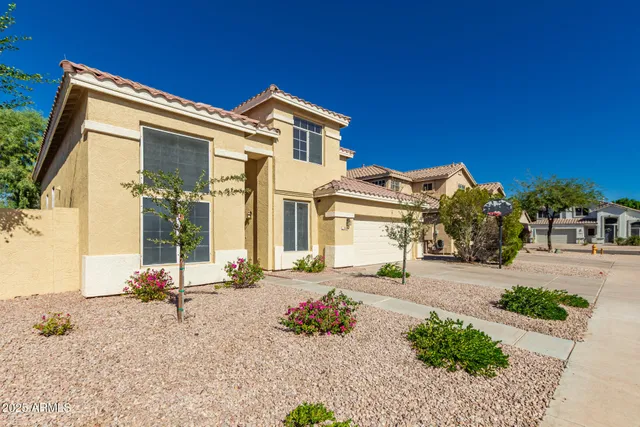 a front view of a house with a view of a house with a yard