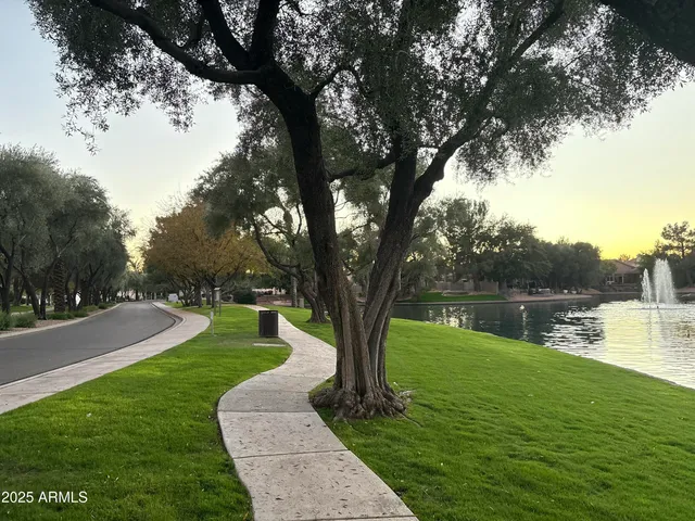 a view of a lake with houses in the background